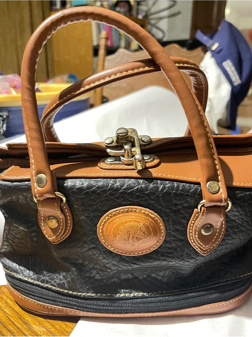 26 International Black and Brown Leather Satchel with Brass Hardware